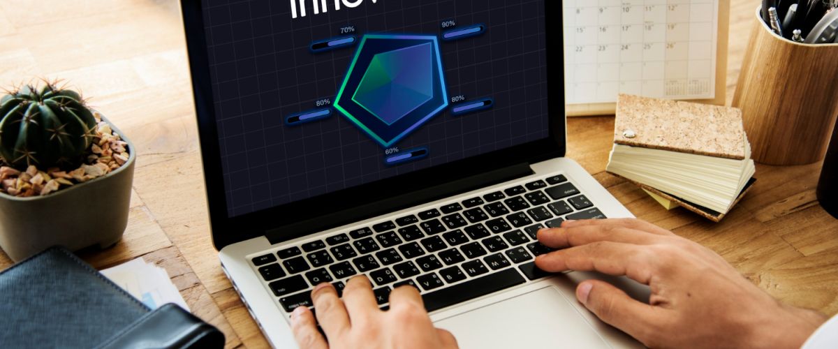 man typing on a laptop with the word innovation on it