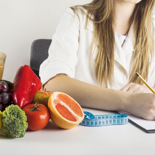 Nutritionists writing on a notebook